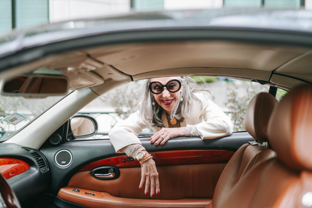 Honey Good leaning into car window as a modern grandmother