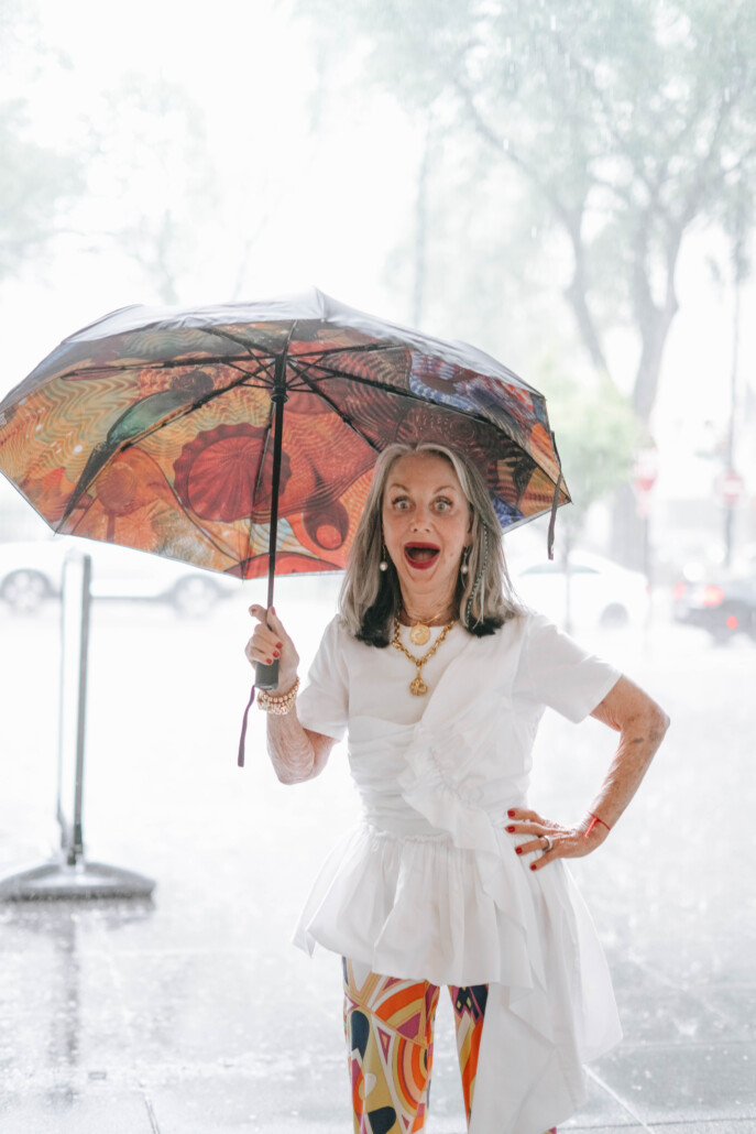 honey good laughing in the rain with umbrella